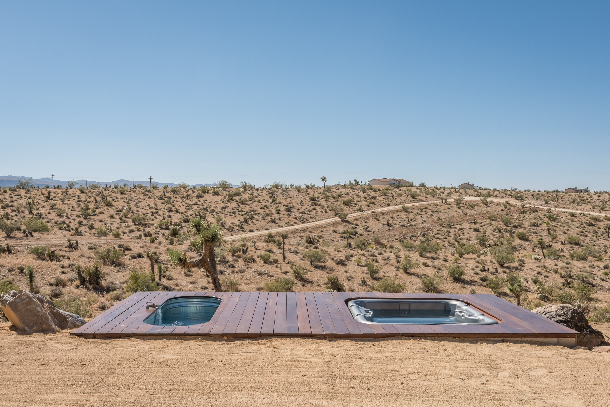 Hot tub and cowboy tub on the private deck at Pause House AM